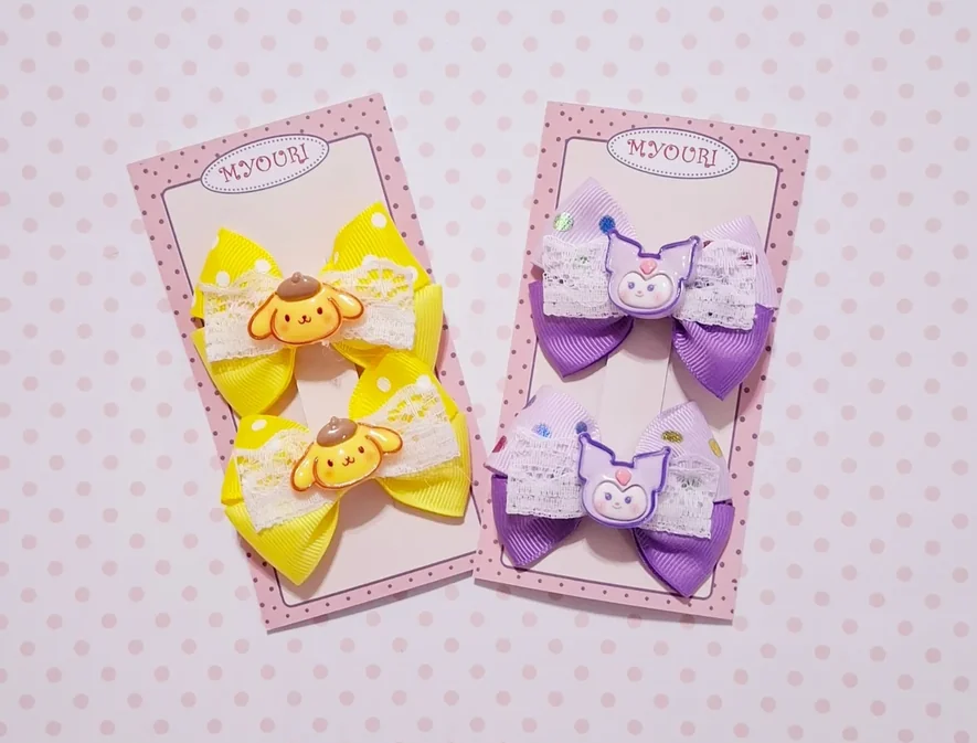 Pita handmade Myouri warna kuning dan ungu pada kartu kemasan pink